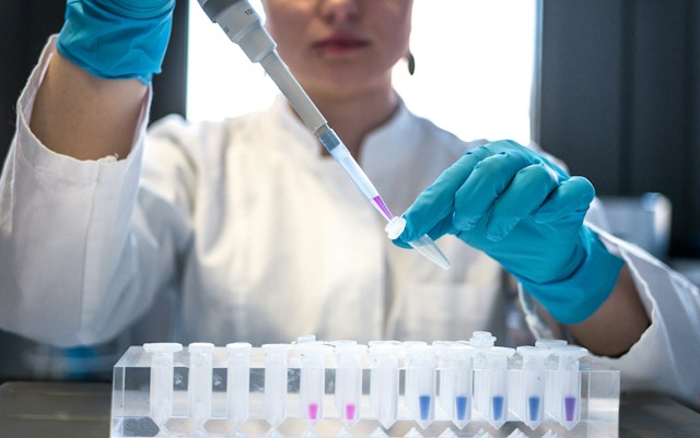 Scientist Examining Fatty Acid PCM Degradation in Laboratory Setting